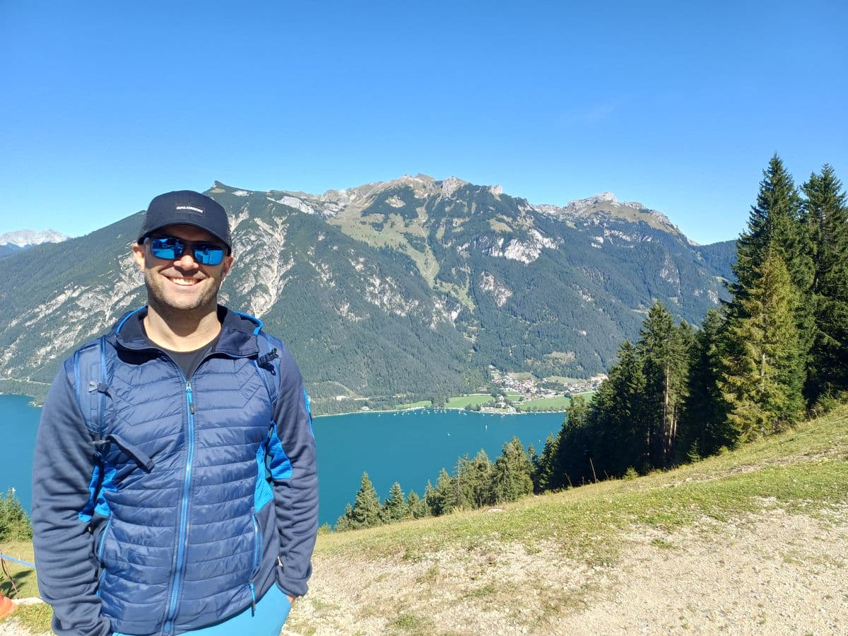 Milan Oesert at Lake Achensee with mountain panorama