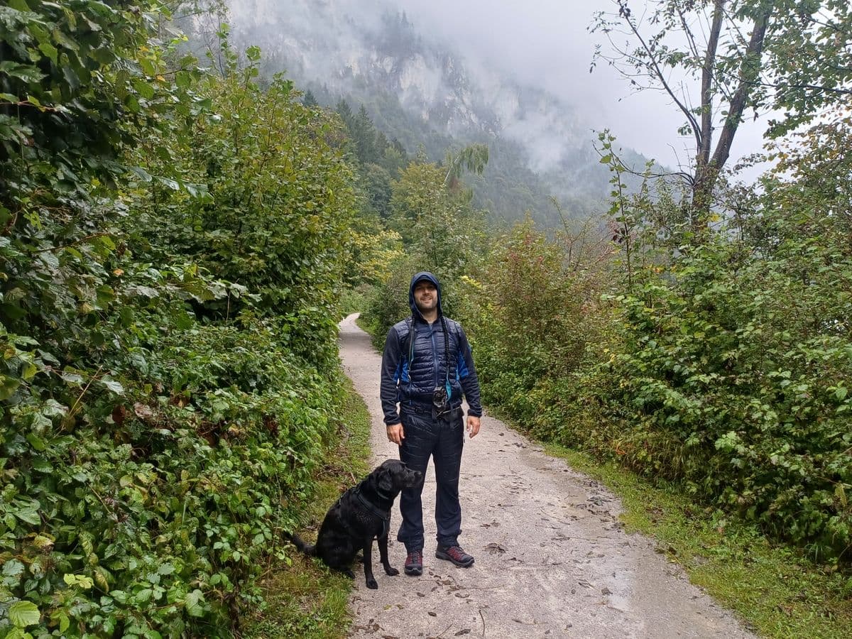 Milan Oesert with dog on misty forest path